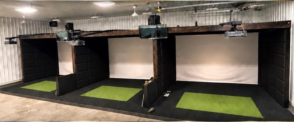 The three simulator bays at Triple Bogeys Club Neenah